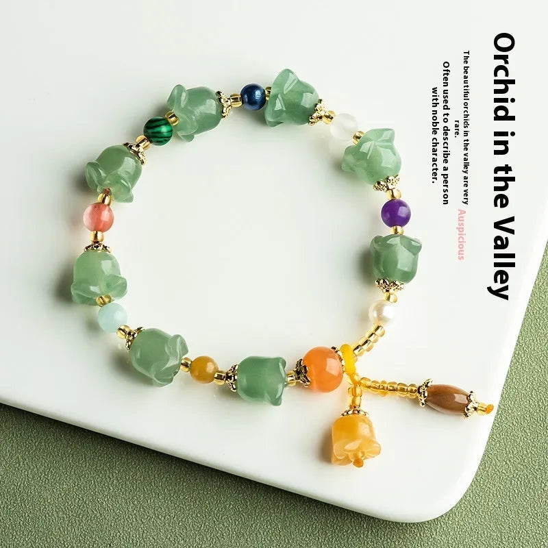 Women's natural jade orchid bracelet with carved beads for 14-18cm wrist.