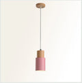 Nordic wood and wrought iron pendant light in black colour, shown above a kitchen island.