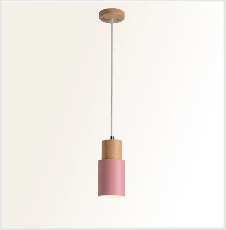 Nordic wood and wrought iron pendant light in black colour, shown above a kitchen island.