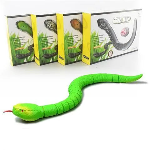Green remote control snake toy with retractable tongue and swinging tail on floor