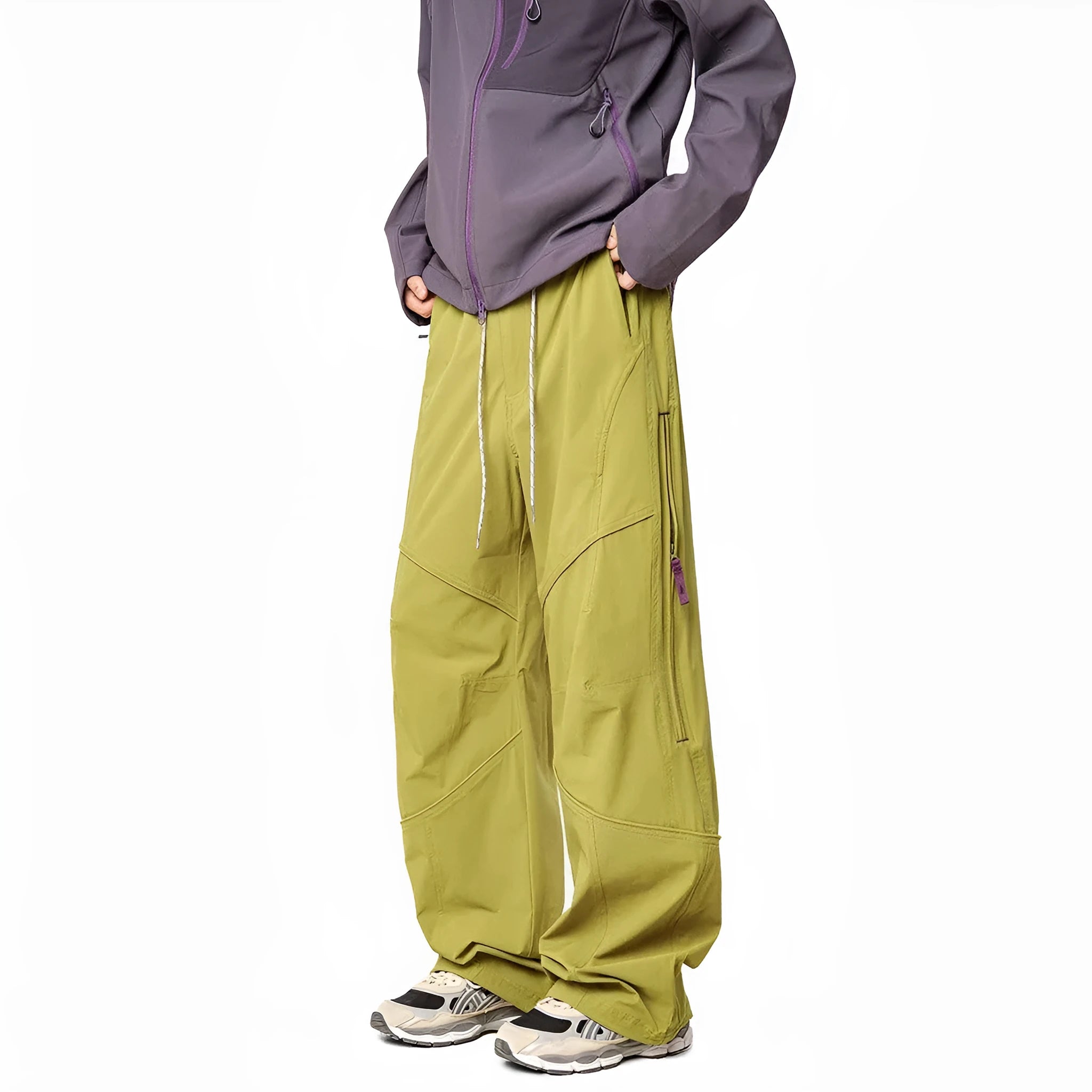 Men's waterproof loose casual pants in Graphite Black for outdoor use, side view on mountain trail