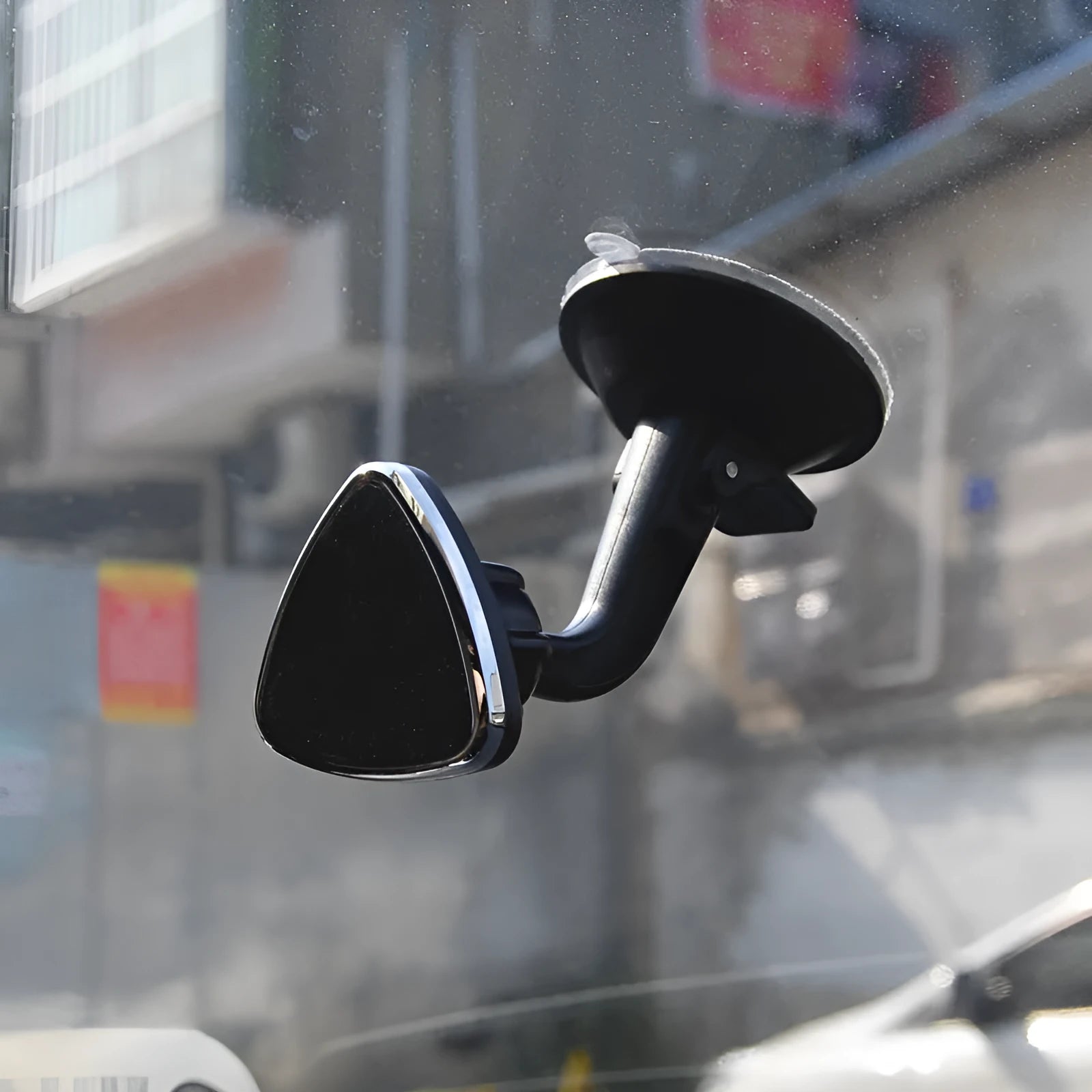 Black magnetic car phone holder with 360-degree rotation for dashboard and windshield mounting