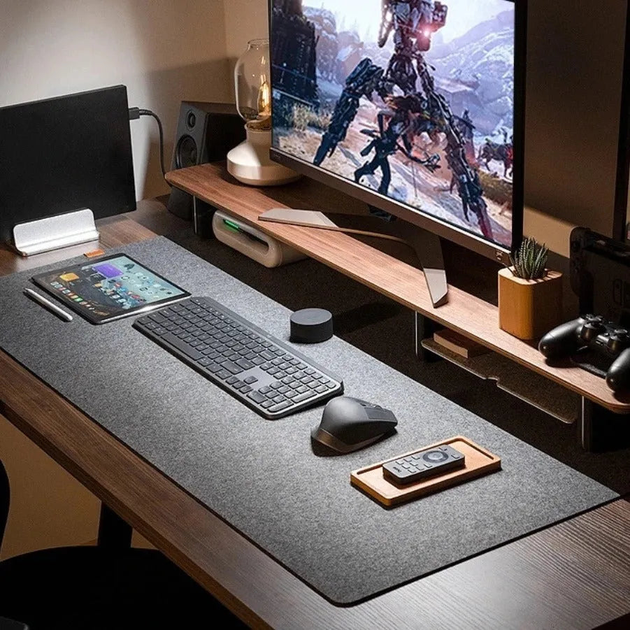 Extra large felt mouse pad in brown, black, grey, or light grey with non-slip backing and machined edges.