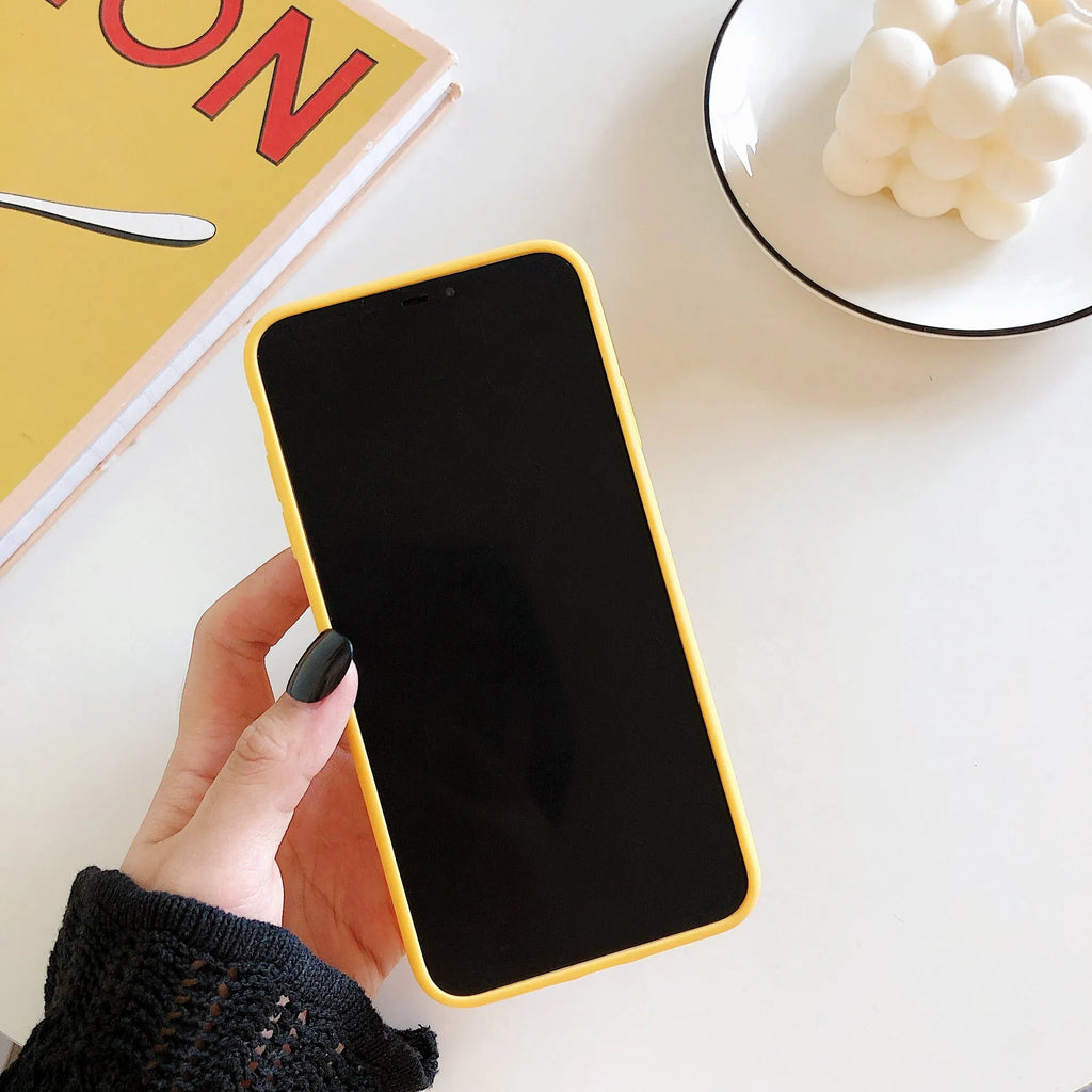 Yellow banana pattern back cover case for iPhone on a white background.