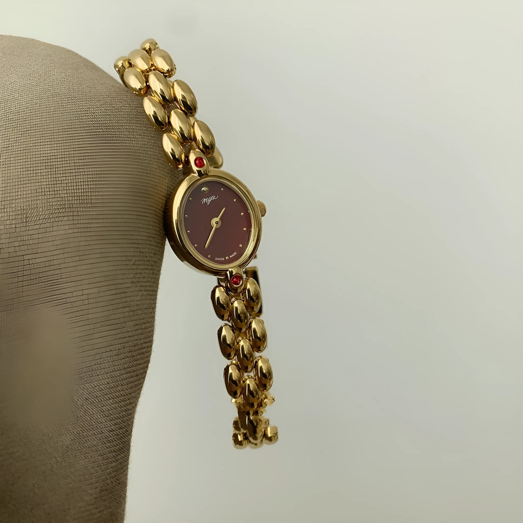 Retro oval small dial women's watch with gold alloy strap, shown in red dial and gold dial options