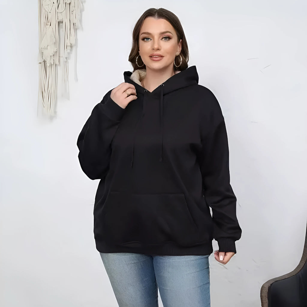 Women's loose fit hooded sweater in thick polyester fabric available in multiple colours.