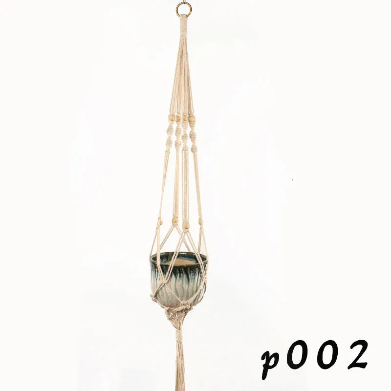 Woven wire plant hanger made from cotton rope in a desktop display style holding a small potted plant.