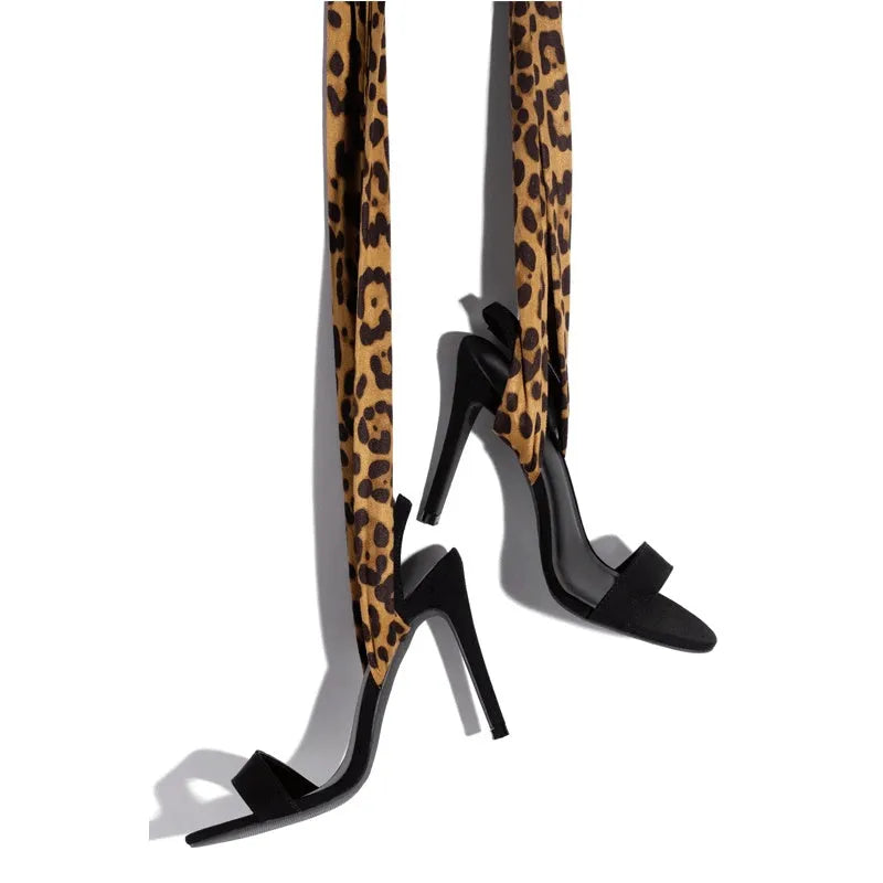 Light brown leopard print women's high-heel sandals with cross straps and an 8cm fine heel on a rubber sole.