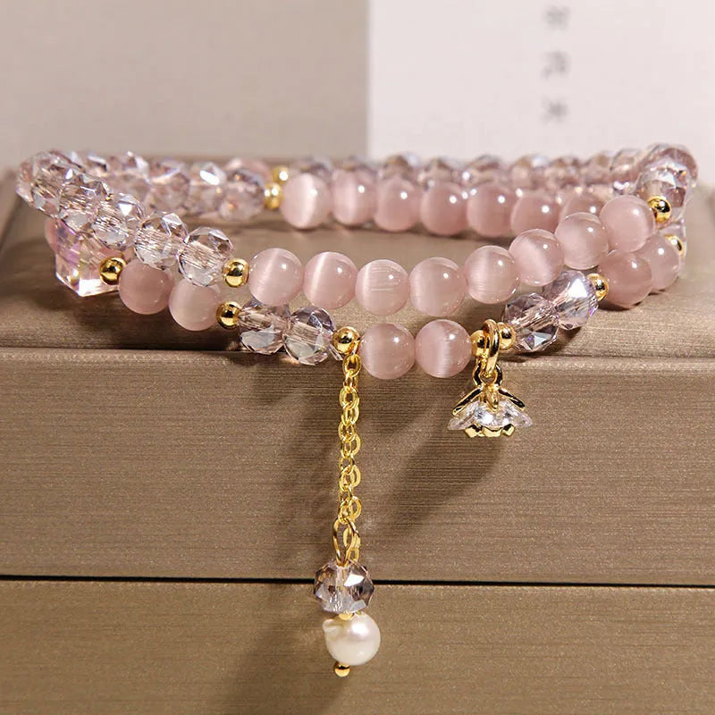 New Chinese style gold-plated double ring bracelet with pink cat eye crystal and zircon small flower detail
