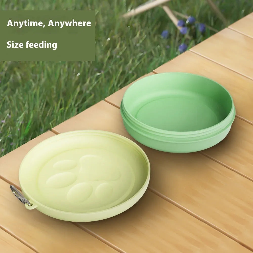 Collapsed and open views of a pink silicone dog bowl with matching sealing lid, next to a dog lead.