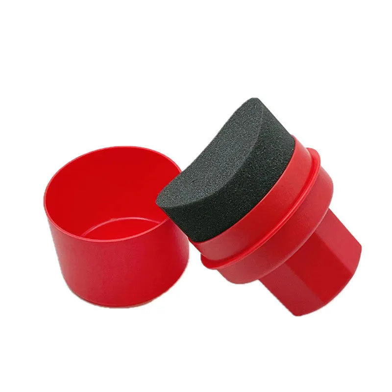 Black car tyre polishing sponge brush with lid on a clean tyre, showing ergonomic PP handle and applicator head.