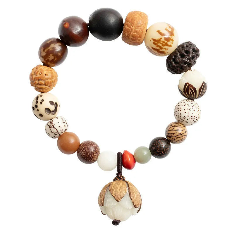 Handmade brown Bodhi seed bead bracelet with geometric design on a 16cm wrist.