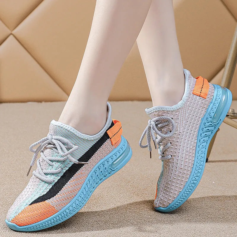 Women's lightweight casual running shoes in purple, black, or orange with plastic sole and lace-up front.