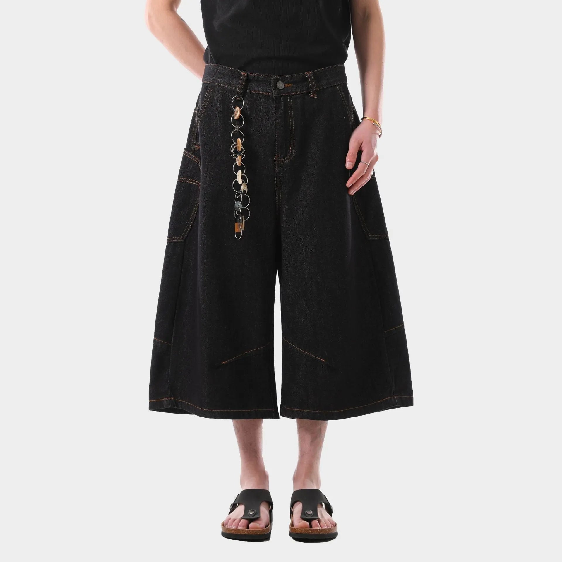 Men's black retro style cropped denim jeans with side pockets on a straight leg.