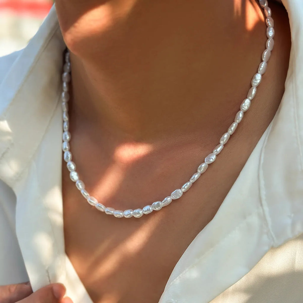 Men's white U-shaped pearl clavicle necklace with mother pearl shellfish pendant on adjustable pearl chain
