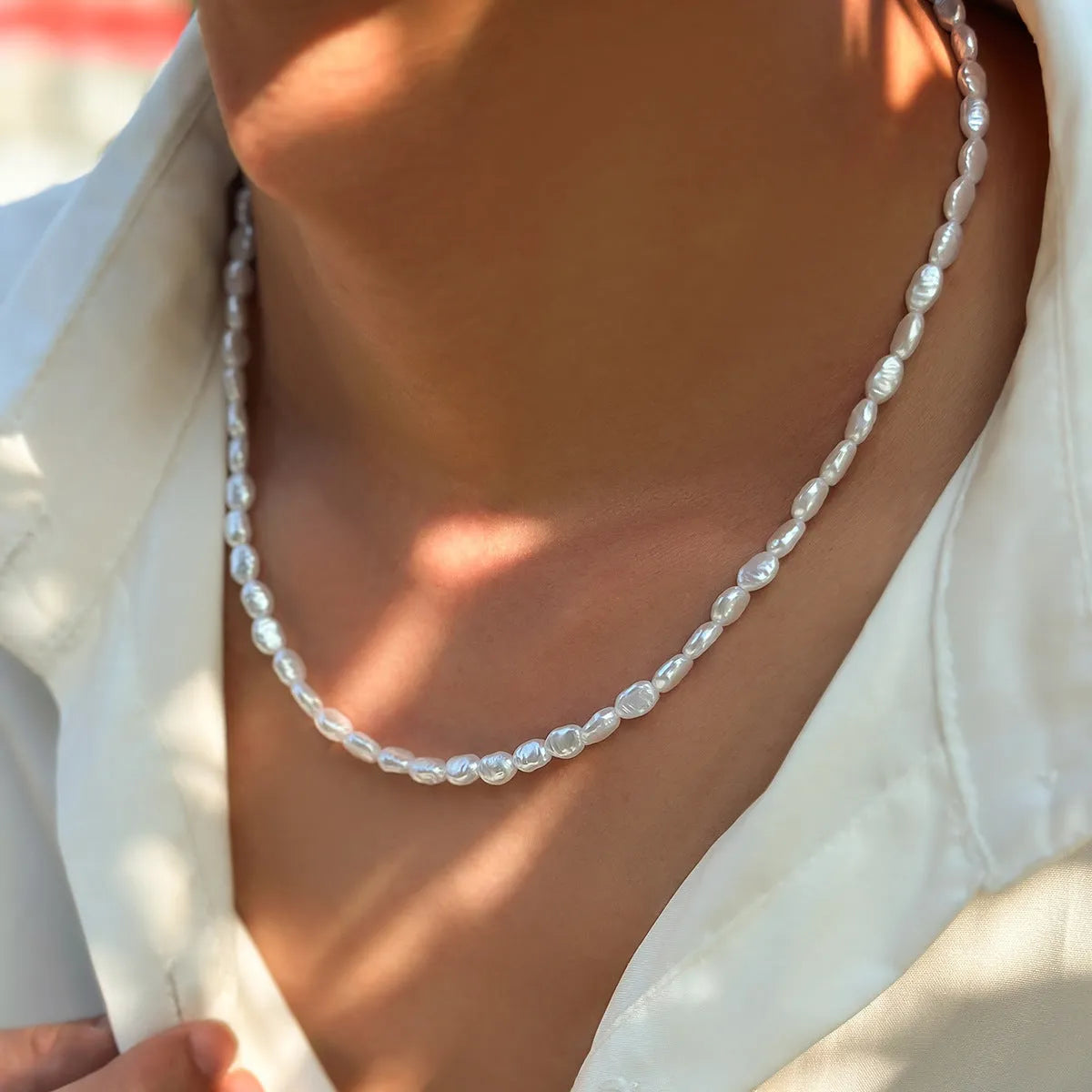 Men's white U-shaped pearl clavicle necklace with mother pearl shellfish pendant on adjustable pearl chain