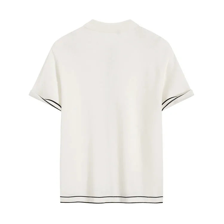 White short-sleeve cardigan with dark contrast colour lapels, laid flat to show front button detail.