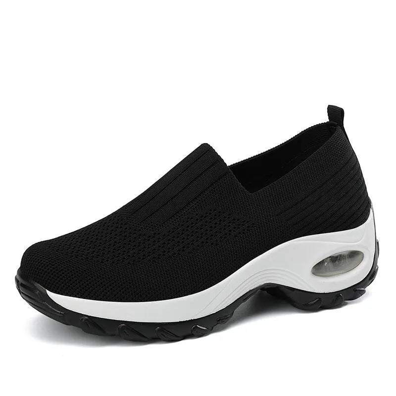 Women's mesh slip on air cushion sneakers in black, with low top and thick bottom, side view