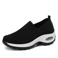 Women's mesh slip on air cushion sneakers in black, with low top and thick bottom, side view