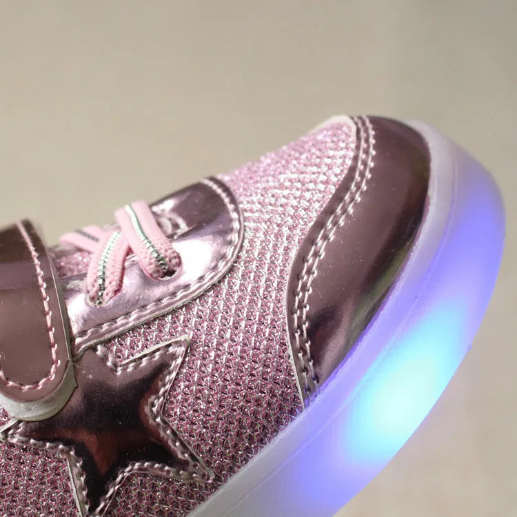 Children's LED magic button shoes with flashing lights in golden, pink, and silvery colours.