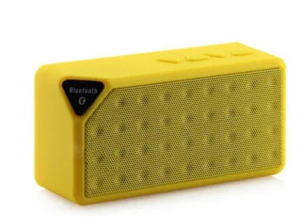Cannon X3 small cube-shaped wireless Bluetooth speaker in chosen colour on a surface