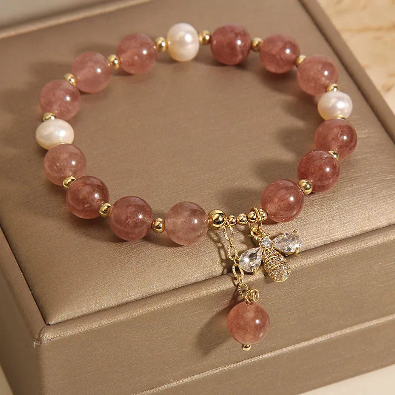 Women's bracelet with strawberry quartz beads, freshwater pearls, zircon details and an alloy clasp