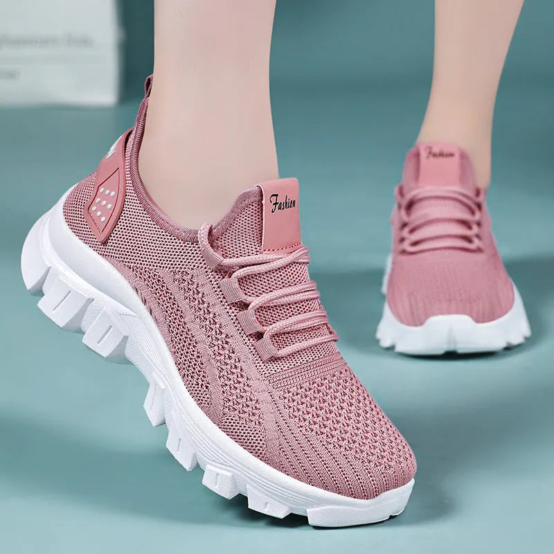 Men's white Flyknit tennis shoes with thick PVC sole and lace-up front
