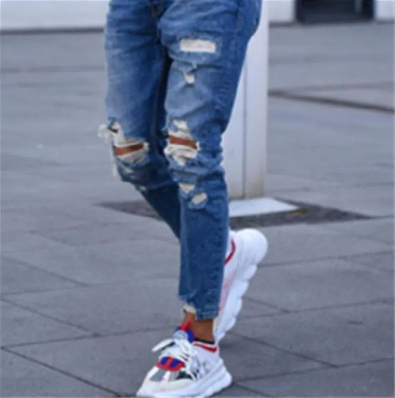 Men's distressed blue jeans with hole detailing in cotton fabric