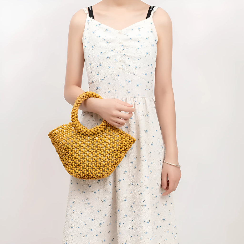 Hand-woven maple hollow handbag with wooden bead decoration, dumpling-shaped 13x7x18cm beach bag