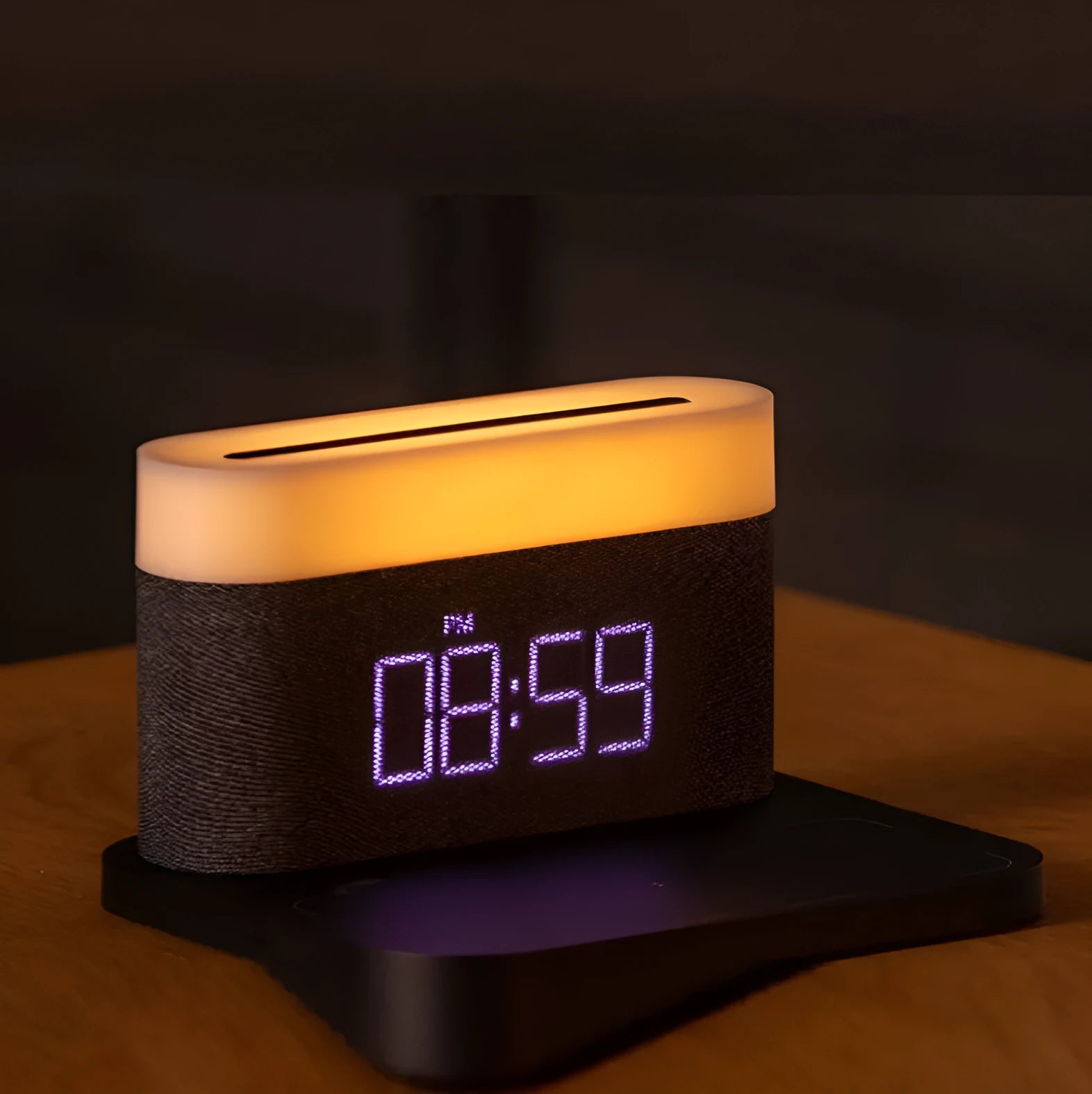 White wireless charging table lamp with integrated alarm clock on bedside table
