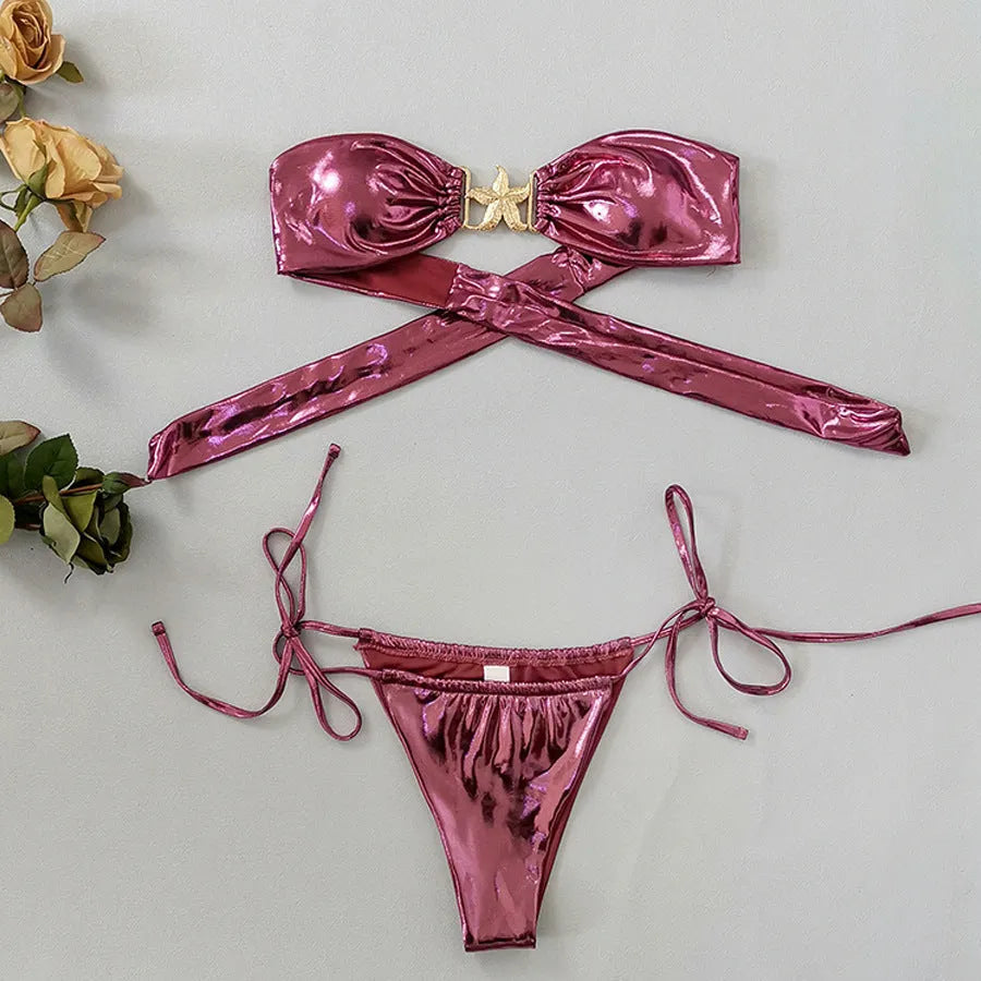 Women's glossy blue bikini set with gold starfish print, long sleeve tube top and split briefs.