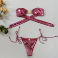 Women's glossy blue bikini set with gold starfish print, long sleeve tube top and split briefs.