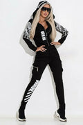 Black women's casual suit with wings print on zip hood top and matching trousers.