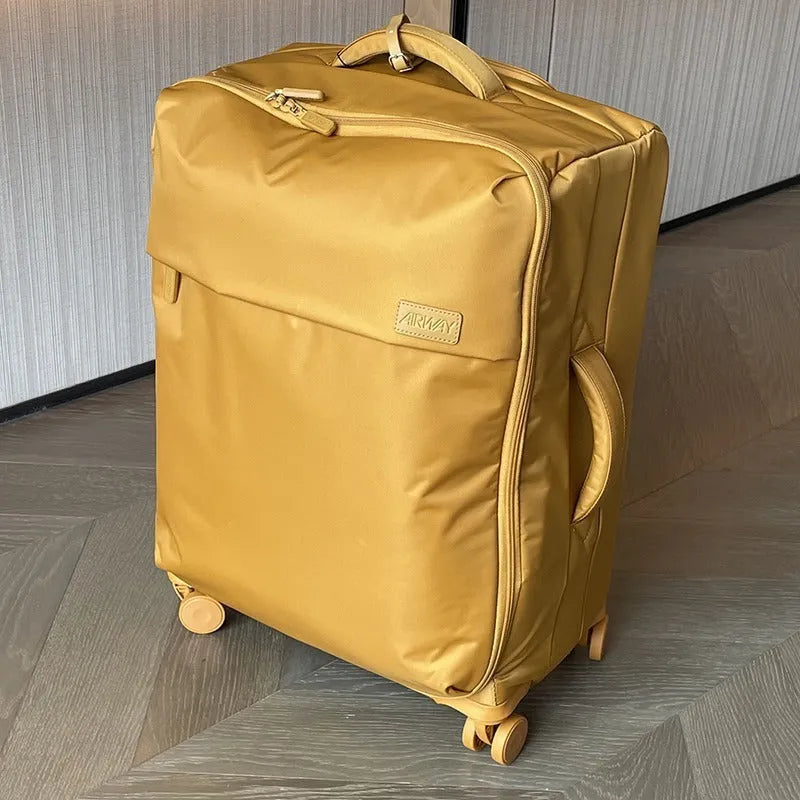 Ultra-light waterproof Oxford cloth suitcase in bluestone green with universal wheels, shown with a 24-inch size example.