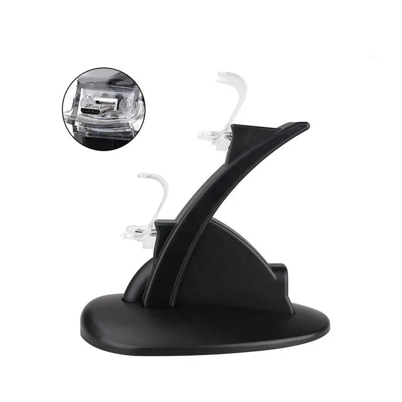 Black dual charging stand holding two Xbox One controllers upright for simultaneous USB charging.