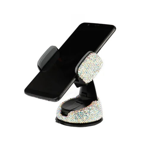 Diamond-encrusted car phone holder mounted on air vent with adjustable push-button mechanism and smartphone securely held