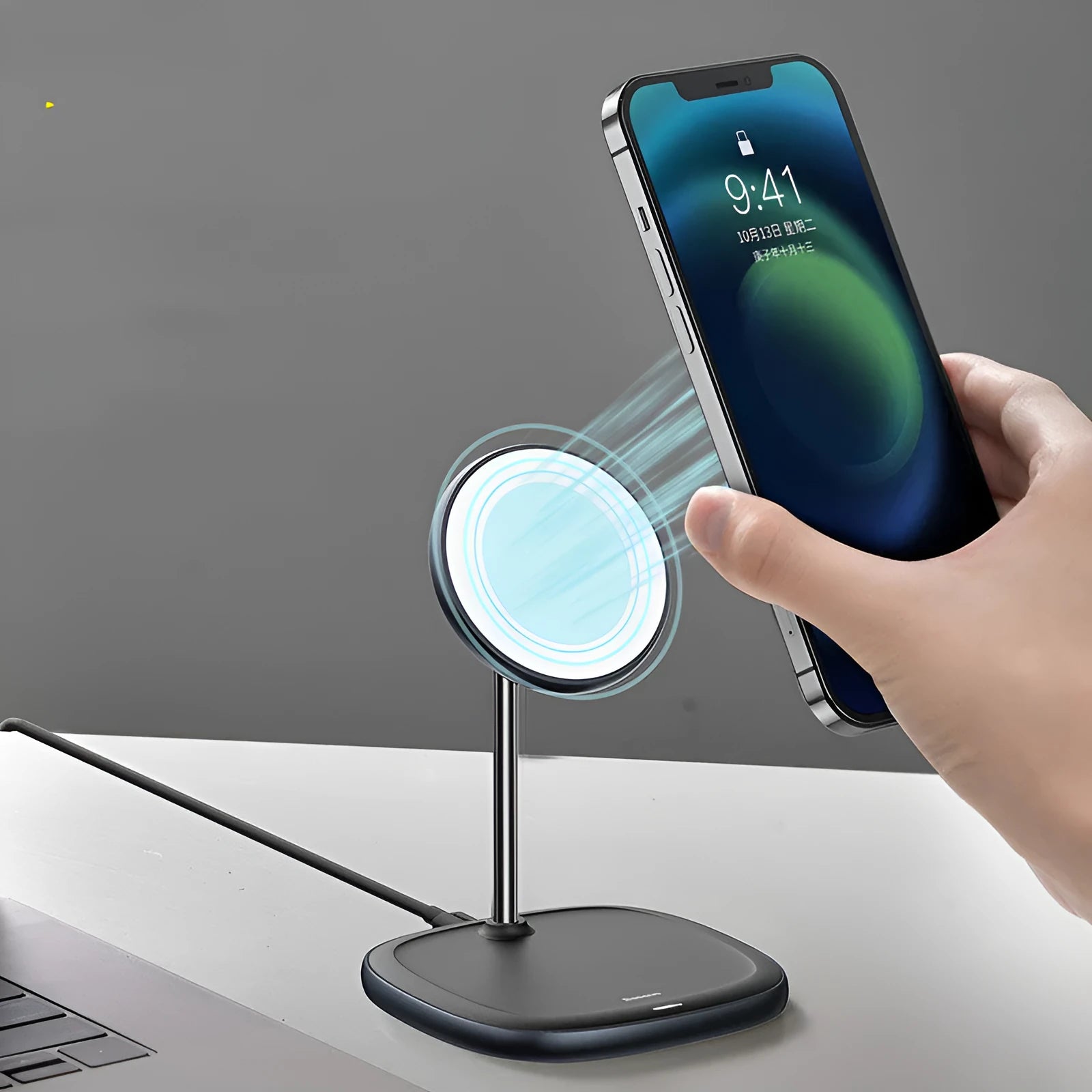 Swan black magnetic wireless charging stand holding an iPhone with a visible cable.