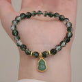 Handmade women's crystal bracelet with citrine, chorite, green phantom quartz hearts and pearls