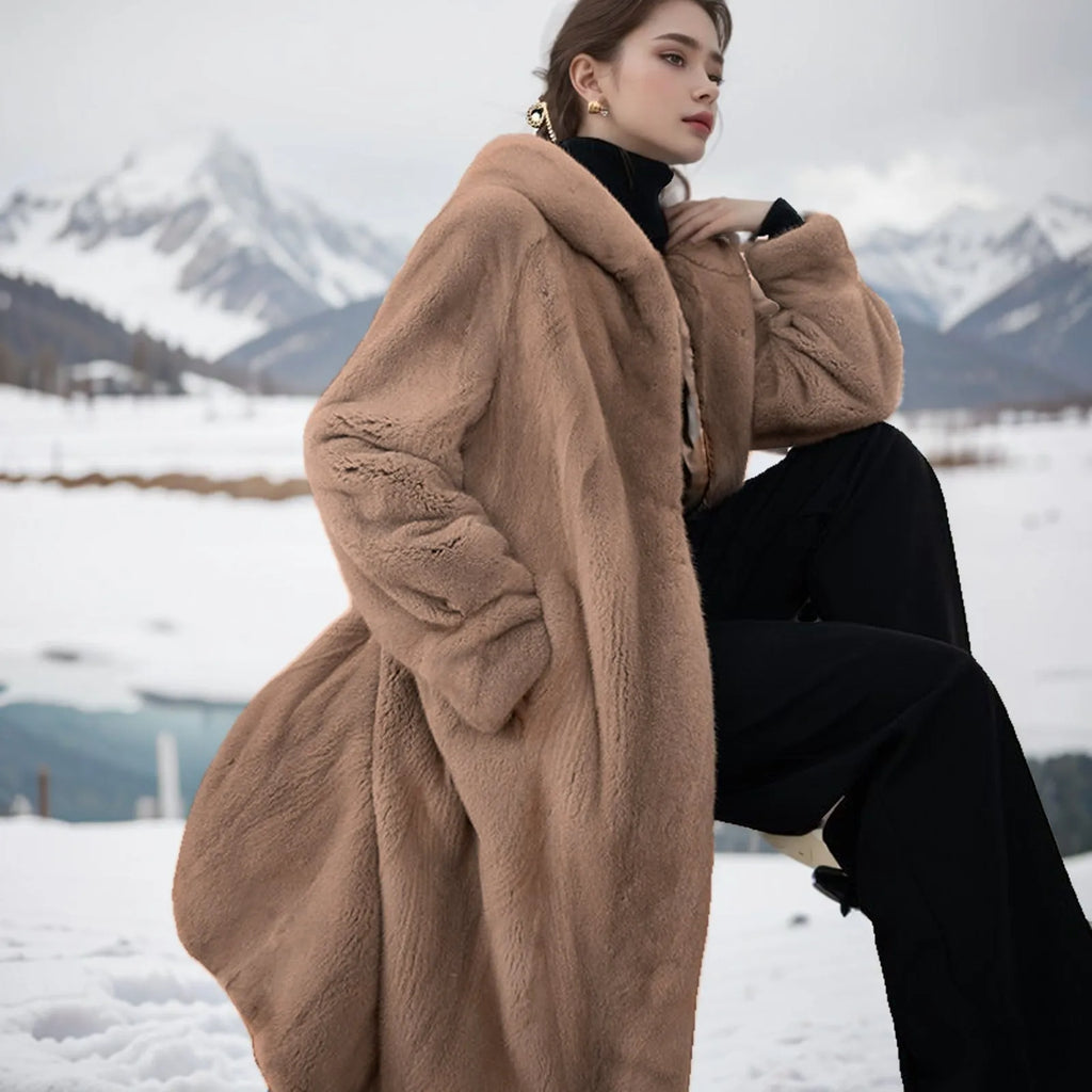 Long brown leopard print faux fur coat on a model, showing loose plus-size fit and regular sleeves.