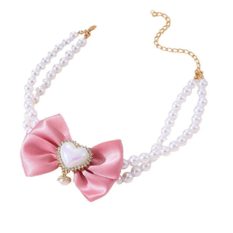 Cute heart shape princess style pet necklace with pearl accents on a cat