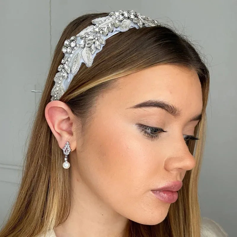 Geometric floral design earrings with micro inlaid zircon detail in gold, platinum, and rose gold finishes.