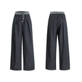 Drooping straight suit pants in black or grey with a high waist and button-open line detail.