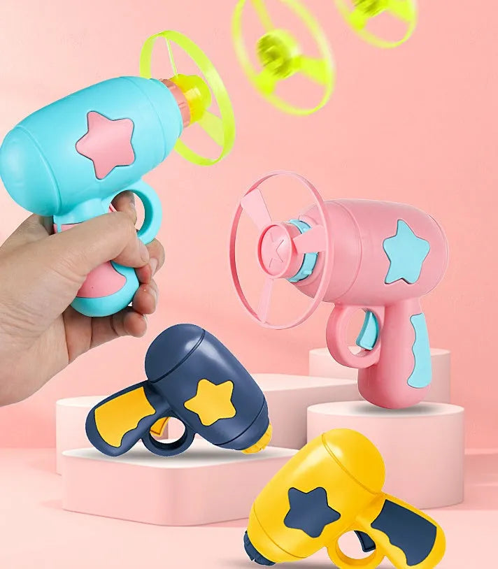 Blue and yellow LED light-up flying saucer launcher toy set with plastic gun and three discs.