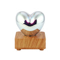 3D love glass small night lamp with silver electroplated finish and solid wood base on a bedside table