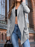 Women's loose fit grey cardigan coat with front pockets showing 65cm medium length