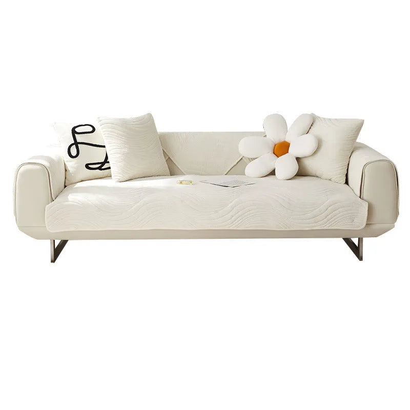 Thickened non-slip flannel sofa cover with geometric pattern in beige on a modern sofa