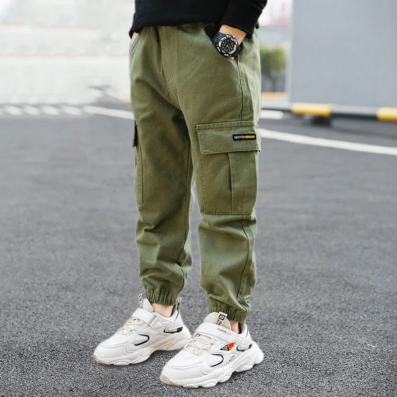 Boys' casual cotton summer trousers in khaki colour with elasticated waist, shown on size chart.