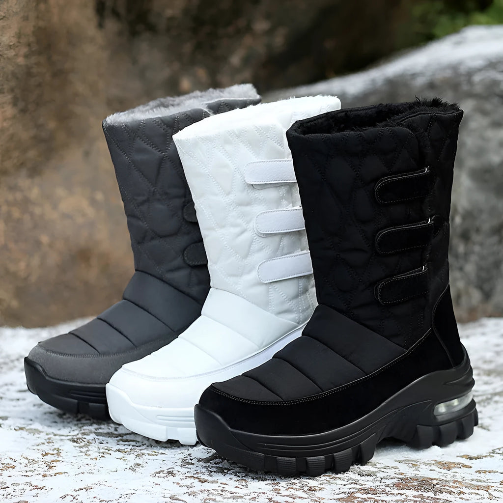 Women's high top snow boots in black with faux fur lining, 5cm heel, Velcro fastening, and PU air cushion sole.