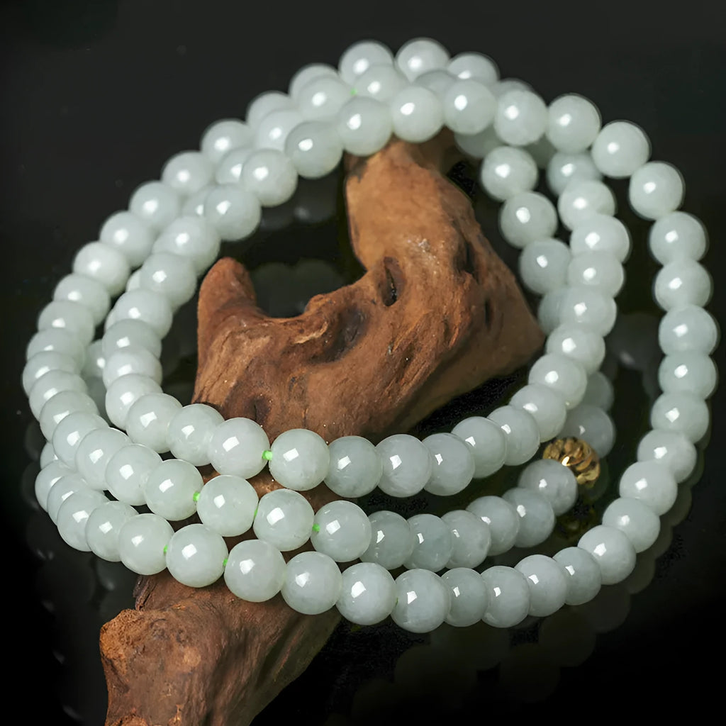 Adjustable natural jade bead necklace with 6.5mm round white and green beads on a long chain.