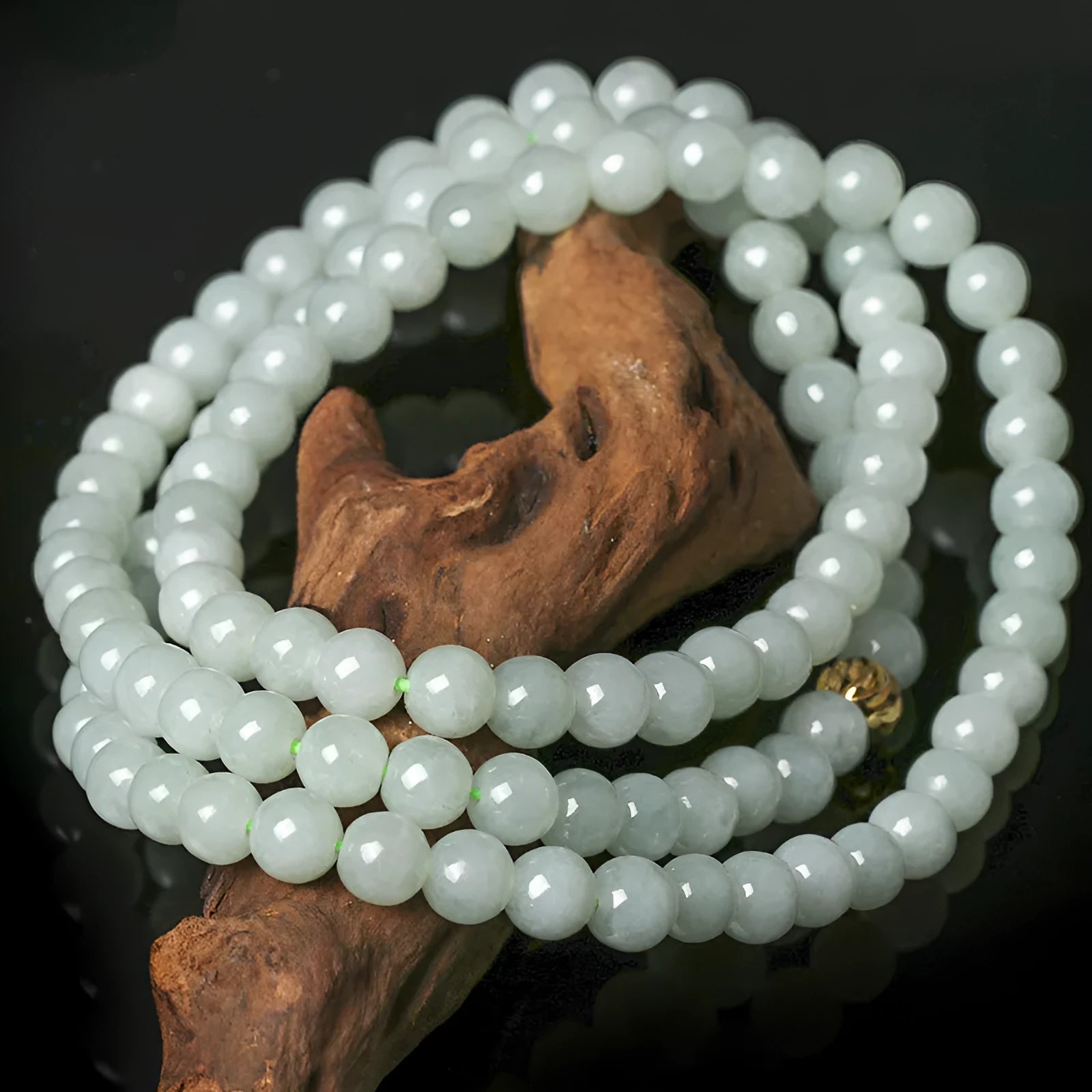 Adjustable natural jade bead necklace with 6.5mm round white and green beads on a long chain.